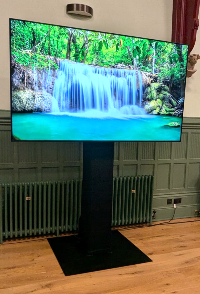 A Samsung 85" Tv with Stand.